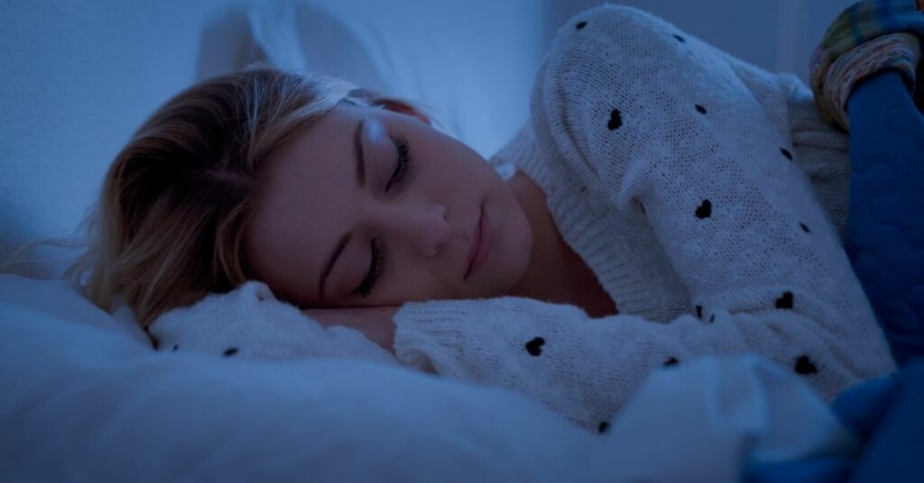 woman sleeping in the dark